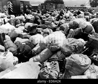 Baggage belonging to evacuees of Japanese ancestry at an assembly center in Salinas,Calif., prior to transfer to a War Relocation Authority center, April 1942 Stock Photo