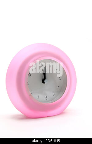 pink round modern alarm clock side perspective Stock Photo