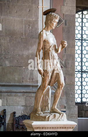 graceful marble statue figure Saint John the Baptist wearing animal skin & carrying delicate staff displayed in Bargello museum Stock Photo