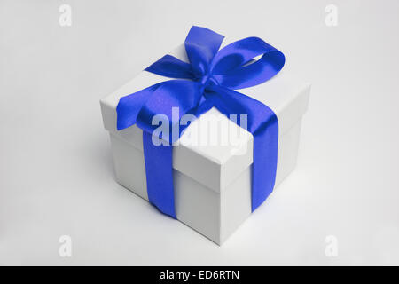 white gift box and blue ribbon Stock Photo