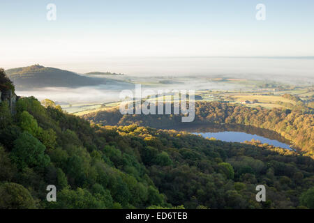 View from above Gormire lake across the Vale of York from Sutton Bank, North Yorkshire. Stock Photo