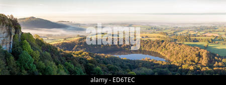 View from above Gormire lake across the Vale of York from Sutton Bank, North Yorkshire. Stock Photo