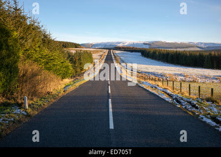 Long straight road on the scottish borders in winter. Scottish / Northumberland Borders Stock Photo