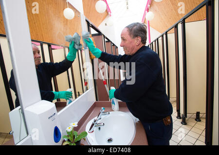 ROB RUSSELL, toilet attendant / cleaner : winner of the  Wales Individual Attendant of the Year, in the 'Loo of the Year' awards 2014 at work at the Park Avenue public toilets, Aberystwyth Wales UK  Dec 12 2014 Stock Photo