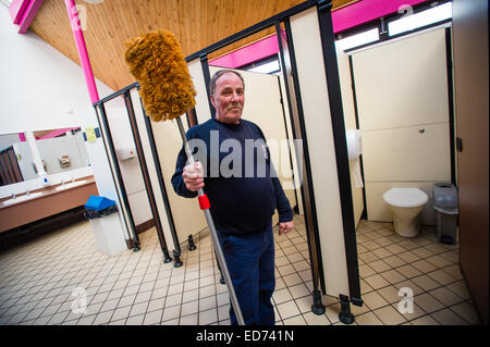 ROB RUSSELL, toilet attendant / cleaner : winner of the  Wales Individual Attendant of the Year, in the 'Loo of the Year' awards 2014 at work at the Park Avenue public toilets, Aberystwyth Wales UK  Dec 12 2014 Stock Photo