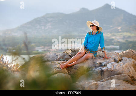 Young woman relaxing outdoors Stock Photo