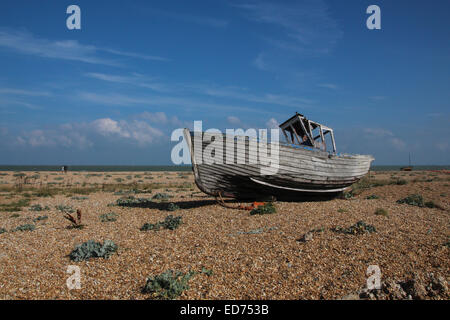 Abandoned boat on the shingle at Dungeness, Britain's only desert Stock Photo