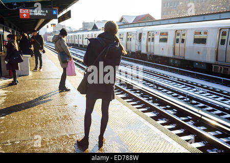 Morning commute, going from Brooklyn to Manhattan at Marcy Avenue station, just before crossing the Williamsburg bridge Stock Photo