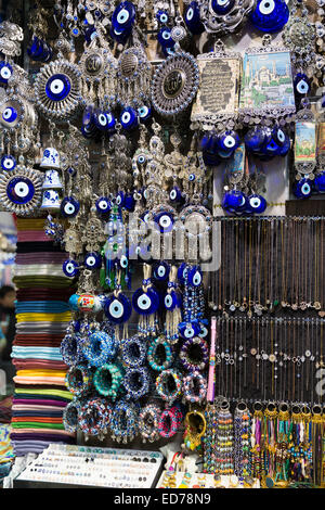Blue Hamsa Turkish Evil Eye beads pendants and trinkets in The Grand Bazaar, Kapalicarsi, great market, Beyazi, Istanbul, Turkey Stock Photo