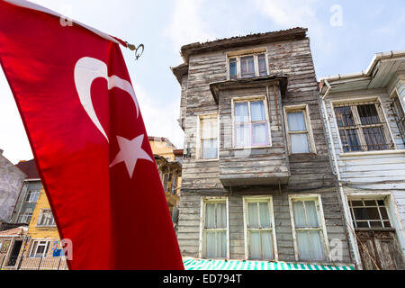 Turkish flag and traditional architecture of homes in the area of Kariye Muzesi, Edirnekapi in Istanbul, Republic of Turkey Stock Photo