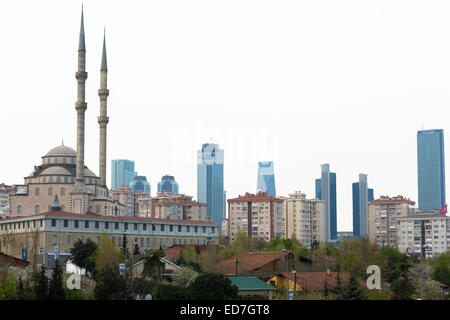 Traditional mosque contrasts with skyscrapers of Levent, financial business district of Istanbul, Republic of Turkey Stock Photo