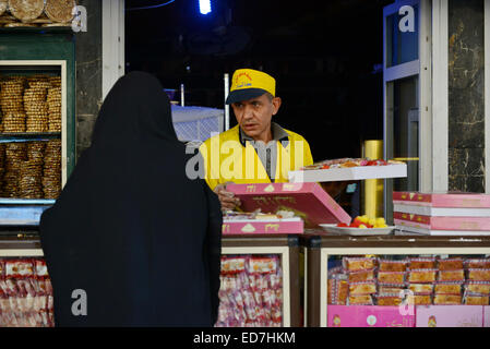 Cairo, Egypt. 29th Dec, 2014. An Egyptian man sells sweets in preparation to celebrate the birthday of prophet Muhammad, also known as ''Mawlid Nabawi'', which will fall next week, in Cairo, December 31, 2014 © Amr Sayed/APA Images/ZUMA Wire/Alamy Live News Stock Photo