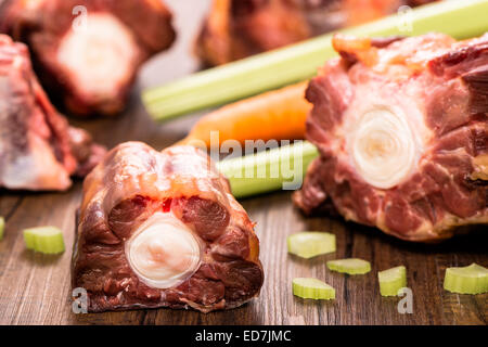 Raw piece of meal from oxtail with celery Stock Photo