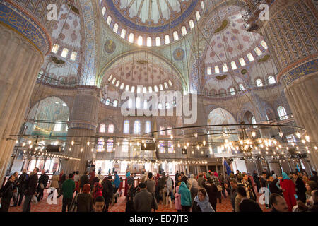 Tourists view domes of the Blue Mosque, Sultanahmet Camii or Sultan Ahmed Mosque 17th Century in Istanbul, Turkey Stock Photo