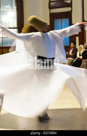 Tourists at Whirling Dervish ayin music performance - Mevlevi Sema - ceremony (whirling dervishes), Istanbul, Republic of Turkey Stock Photo