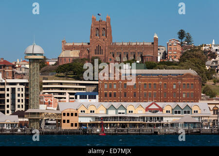 The Anglican Christ Church Cathedral dominates the skyline of Newcastle with Queens wharf in the foreground Newcastle Australia Stock Photo