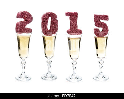 Glittering 2015 New Year digits placed in four champagne glasses shot on white Stock Photo