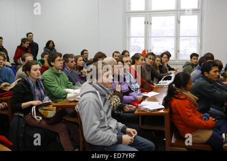 Prague, Czech Republic. 31st December 2014. Young pilgrims listen to the workshop on the involvement of young Christians in politics. The third day of the European Taize meeting continued with the communal prayers and several workshops and group discussions on different aspects of Christianity in today's world. Br. Alois announced Valencia in Spain as the host city for next year's meeting. Stock Photo