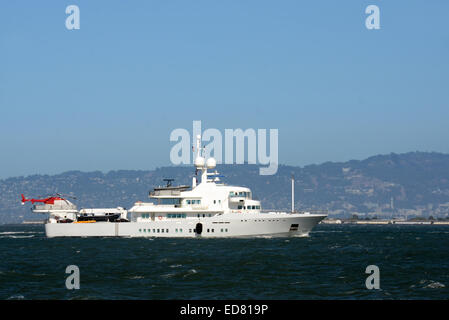 Luxury yacht with helicopter on the back side view Stock Photo