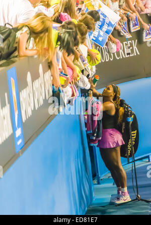 Serena williams with fans signing tennis balls at the Rod Laver arena Melbourne Open australia Stock Photo