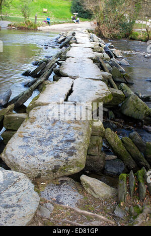 Tarr Steps, an ancient clapper bridge across the River Barle in the Exmoor National Park, Somerset, England, UK. Stock Photo