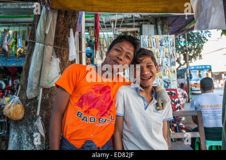 Two young  lads chewing betel leaf and areca nut Stock Photo