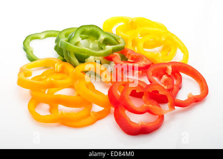 fresh slices of red, green, yellow and orange pepper isolated on white background Stock Photo