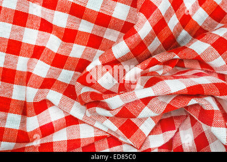 Red and white wrinkled checkered tablecloth pattern texture as background Stock Photo