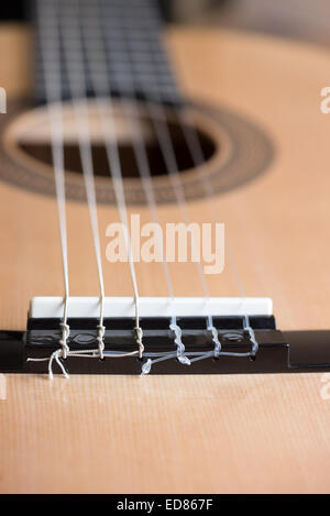 acoustic six-string guitar on the background of wooden panels Stock Photo