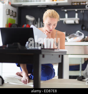 Female freelancer working from home. Stock Photo