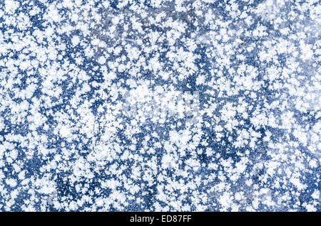 white snowflakes on blue  ice Stock Photo