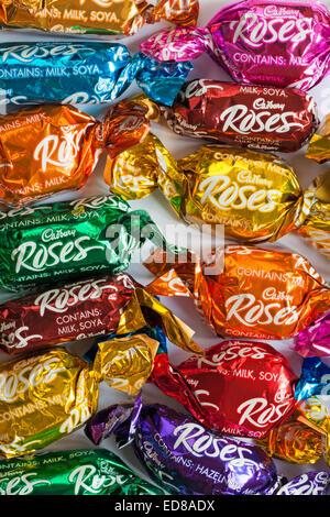 spread of Cadbury Roses chocolates removed from open box  - Cadburys Roses selection Stock Photo