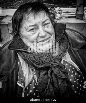 Sales person at Rozycki Bazaar in front of her merchandise Stock Photo