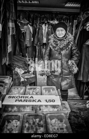 Sales person at Rozycki Bazaar in front of her merchandise Stock Photo