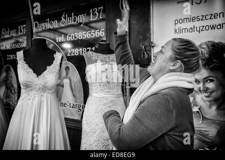 Sales person at Rozycki Bazaar in front of her merchandise Stock Photo