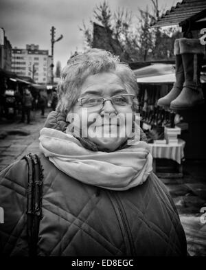 Sales person at Rozycki Bazaar in front of her merchandise Stock Photo