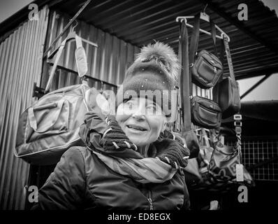 Sales person at Rozycki Bazaar in front of her merchandise Stock Photo