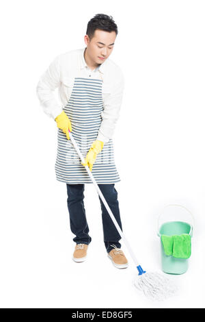 chinese male with cleaning sweep, white background Stock Photo