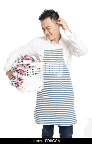 chinese man holding a laundry basket isolated on white background Stock Photo