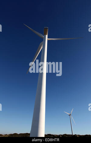 Two of the giant windmills on a wind farm on the Northern Cretan coast near Plaka Stock Photo