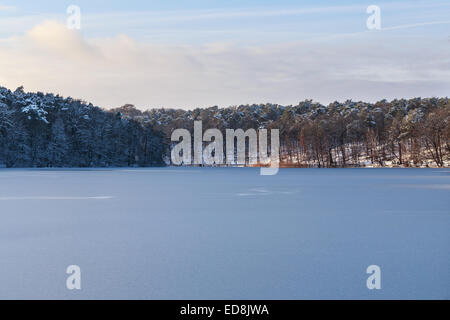 View across partially frozen Lake Schlachtensee in Berlin, Germany in winter. Stock Photo