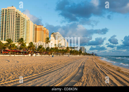 Ft. Lauderdale, Florida.  Sunrise along the Beach.  Tracks are from early morning beach cleaner. Stock Photo