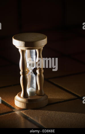 timer hourglass streaming grains of sand flowing through depicting things are running out