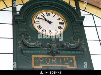 Old station clock in the famous Sao Bento Railway Station at the Almeida Garret Square in Porto, Portugal. Stock Photo