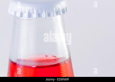 Red drink in the bootle. Bubbles . Stock Photo