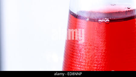 Red drink in the bootle. Bubbles . Stock Photo