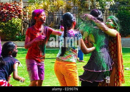 Group of young girls playing with powder colors & water during the spring hindu festival Holi also known as a festival of colors Stock Photo