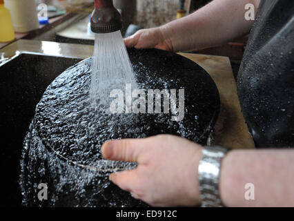 Diepholz, Germany. 09th Aug, 2012. Before galvanizing Rainer Schierbaum washes a blank at the record factory Pallas in Diepholz, Germany, 09 August 2012. Photo: Carmen Jaspersen/dpa/Alamy Live News Stock Photo