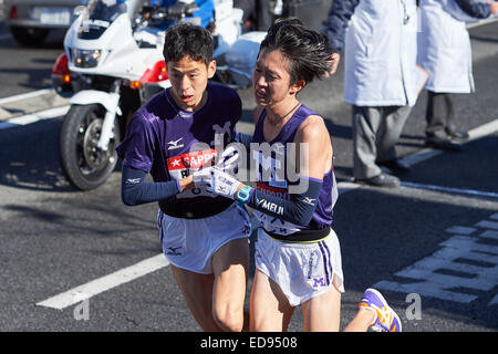 Kanagawa, Japan. 2nd Jan, 2015. Kei Fumimoto, Tomoyasu Matsui (Meiji Univ) Athletics : The 91st Hakone Ekiden Race in Kanagawa, Japan . © AFLO SPORT/Alamy Live News Stock Photo