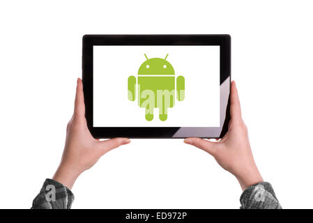 Novi Sad, Serbia - January 02, 2015: Hands Holding Digital Tablet Computer with Android Logo displayed on the screen. Stock Photo